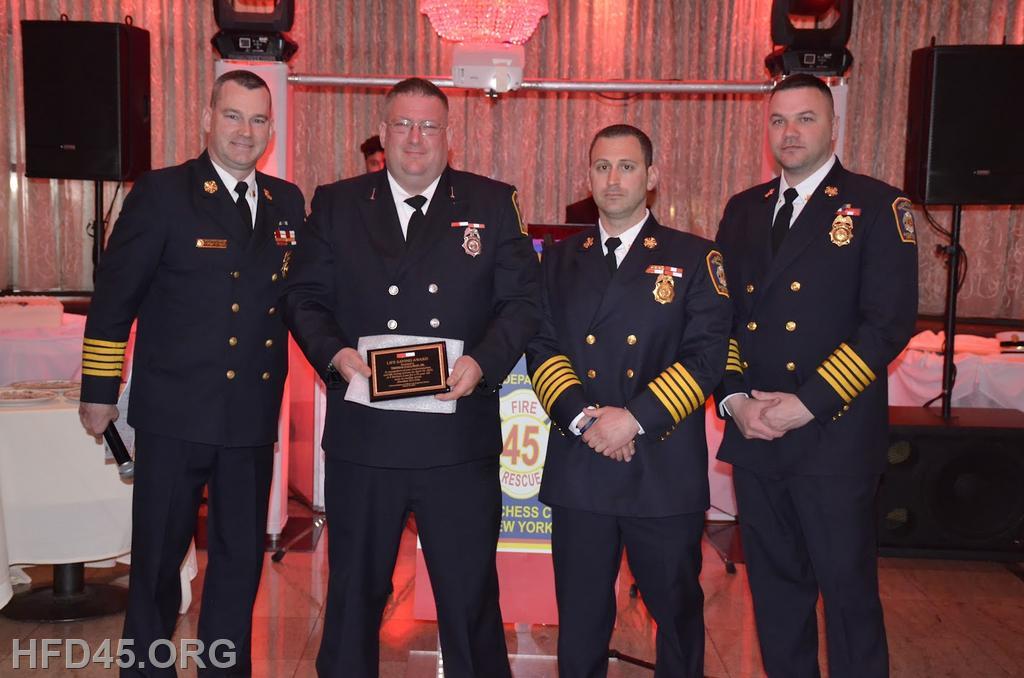 LIFE SAVING AWARD
EMS Lieutenant Thomas Gallman, Sr. was issued a Life Saving Award for his actions on April 30, 2022. Hughsonville FD and Town of Wappingers Ambulance were dispatched to male with chest pain. While Town of Wappingers Ambulance began transporting the patient to the local hospital the patient went into cardiac arrest. The ambulance was then pulled over and EMS LT. Gallman entered the ambulance and began assisting the crew with CPR. Due to actions of the crew from Town of Wappingers Ambulance and EMS Lieutenant Thomas Gallman this patient has made a full recovery.  
